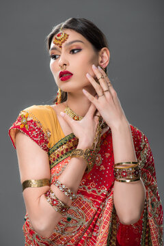 Young Indian woman poses gracefully in a festive saree for Diwali celebration