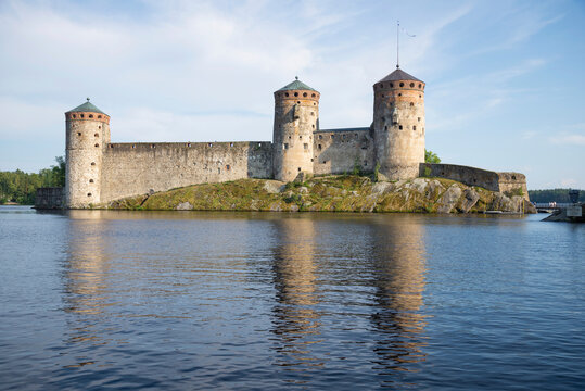 Three towers of the ancient Swedish fortress of Olavinlinna (Olafsborg) on ​​a sunny September day. Savonlinna, Finland