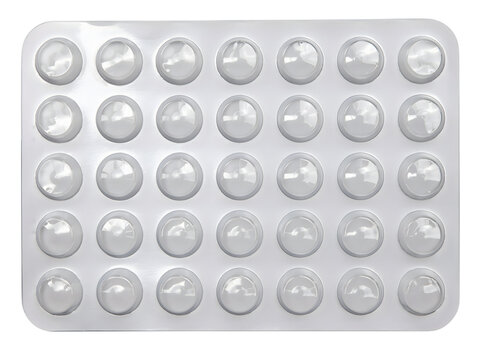 Empty plastic blister pack with circular compartments arranged on transparent background