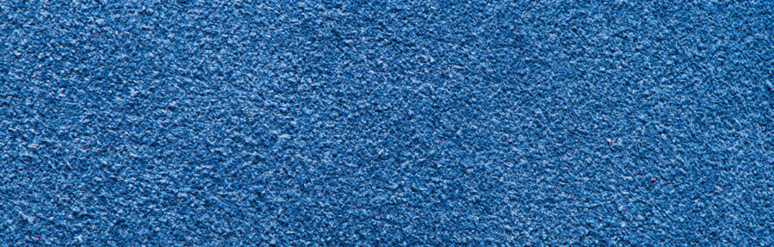Deep blue suede leather texture background with soft nap and fine grain pattern
