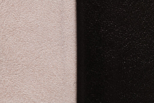 Two-tone leather texture background with vertical split dividing light beige and dark black pebble grain sections