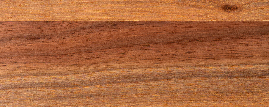 Rich brown wood grain texture background with horizontal grain pattern and natural knot