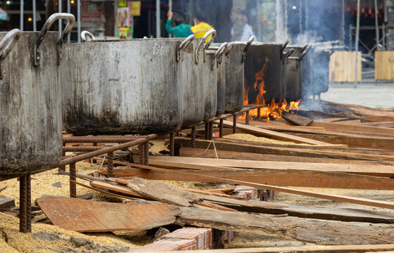 Large cooking pots over wood fires in Tam Coc, Vietnam, for boiling traditional b&aacute;nh chưng. Luna new year.