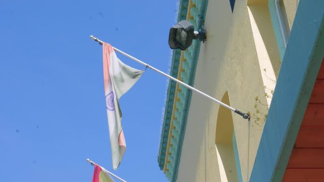 National Flag of India Flying on Building Wall Under Blue Sky