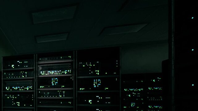 Rows of metallic server racks fill the dimly lit room with small green lights blinking to show active processing cycles in the dark facility while silent machines handle large amounts of data at night