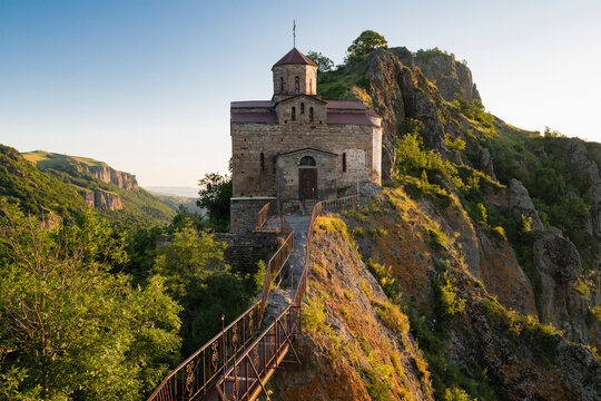 The ancient Shoana temple (St. George the Victorious church) in a mountainous landscape on a sunny July morning. Karachay-Cherkessia, Russian Federation