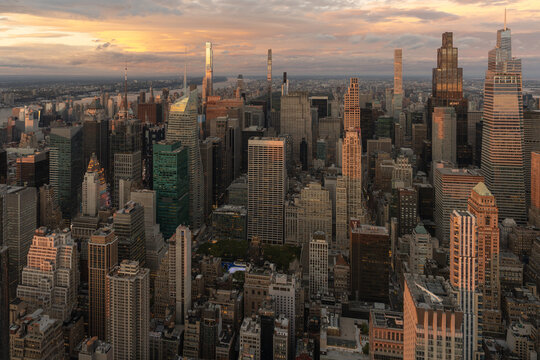 Midtown Manhattan skyline glowing at sunset