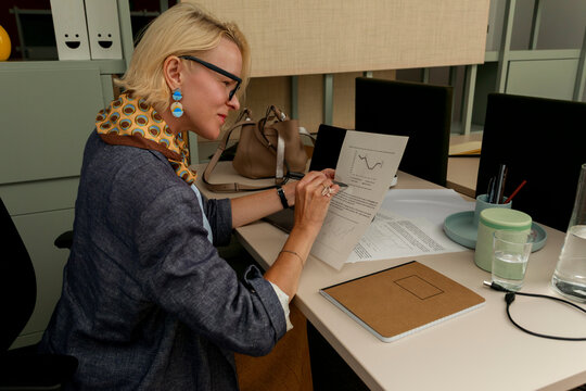 Woman  Reviewing Documents at office