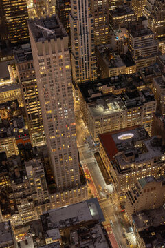 Manhattan streets and buildings illuminated at night