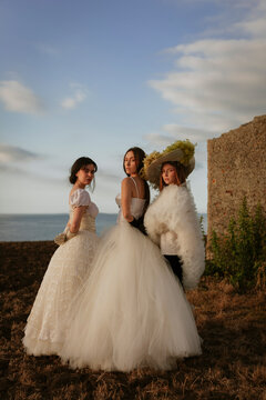 Three young brides in the sunset