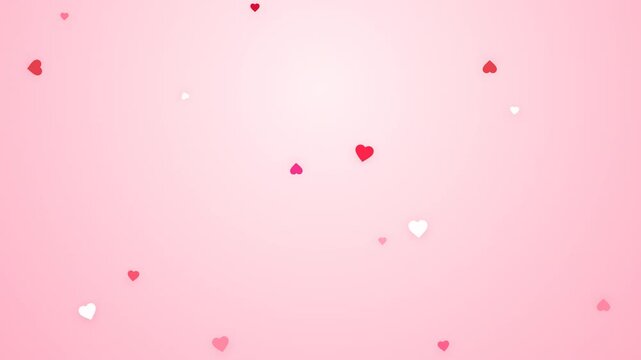 Tiny red and pink hearts falling on a soft pink gradient background