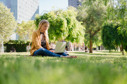 Freelance Woman Working Outdoors Instead of in an Office