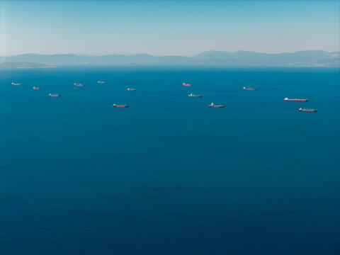 Global trade logistics with cargo ships navigating Piraeus waters