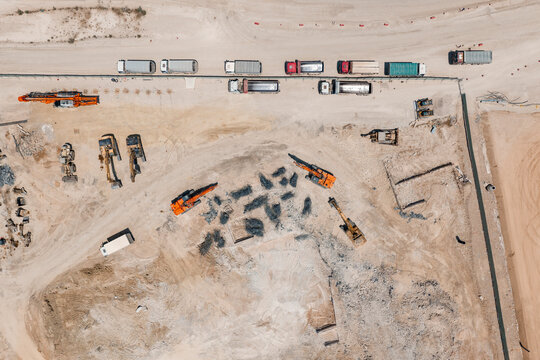 Construction site aerial view with heavy machinery
