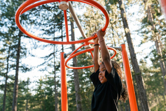Child Exploring the Outdoors on a Playground
