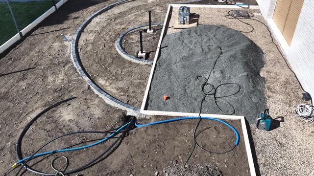 Elevated view of curved borders in a garden under construction