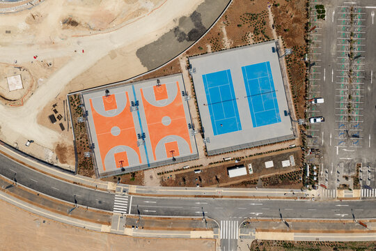 Aerial view of modern sports courts complex.