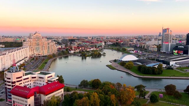 Panorama of central Minsk, featuring views of Svislach River, Sports Palace, and Trinity Suburb. Aerial view of cityscape under pink sunset sky urban landscape. . Belarus, Minsk, September 16, 2026