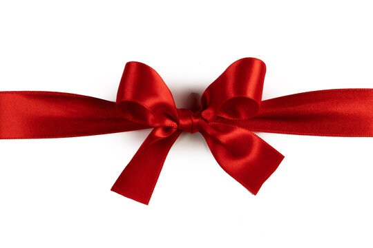 A red ribbon tied in a bow across the page