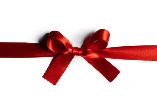 A red ribbon tied in a bow across the page