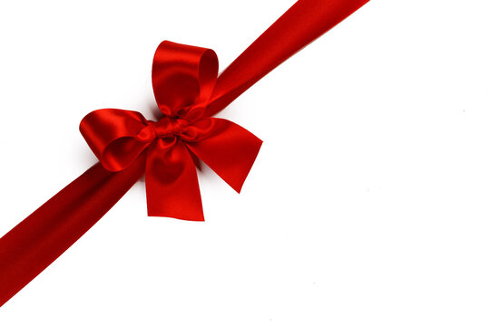 A red ribbon tied in a bow across the page