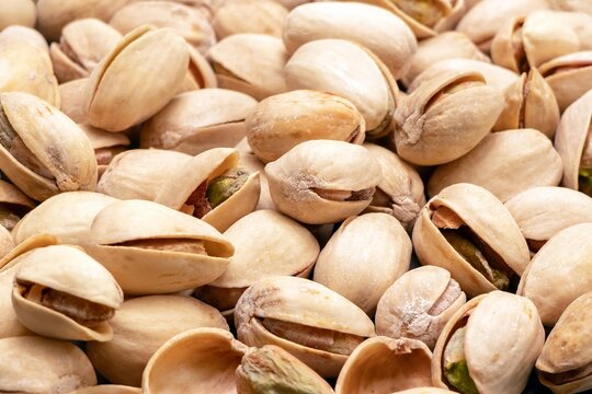 Close Up of Roasted Pistachio Nuts in Shells Filling the Frame