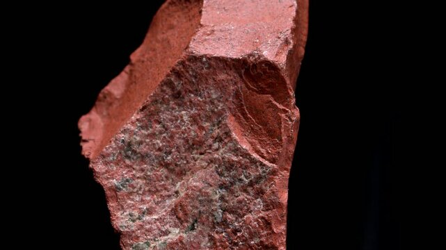 Red Jasper (opaque cryptocrystaline quartz) sample rotating slowly against a black background.