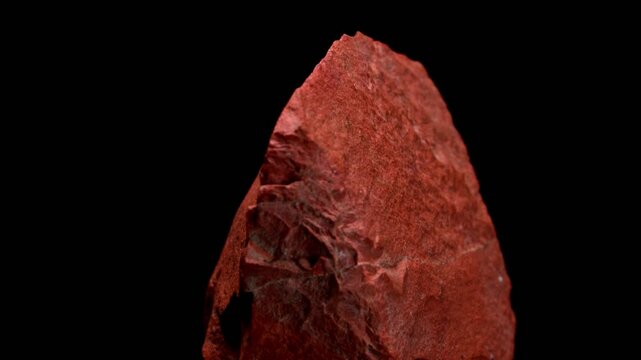 Red Jasper (opaque cryptocrystaline quartz) sample rotating slowly against a black background.