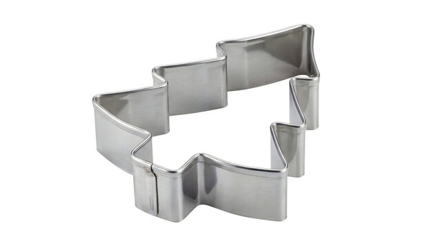 Metal christmas tree cookie cutter with sharp edges used for cutting shapes out of dough during holiday baking sessions in home or professional kitchens.