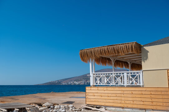 Thatched seaside pavilion beside the waterfront in Alanya, Turkey, during the day