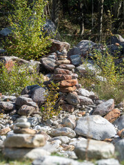 Balanced stack of stones at Verzasca River trail (Sentiero Verzasca), Switzerland © Catalin