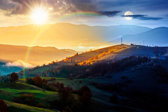 mountainous countryside landscape. day meet night. sun and moon on epic sky above the distant valley. colorful fields and trees on the hill. beautiful nature landscape of Carpathians