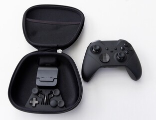 Professional black video game controller with case and accessory kit © YouraPechkin