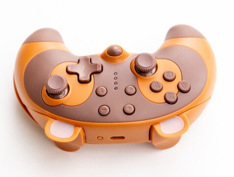 Closeup of a unique orange and brown wireless video game controller