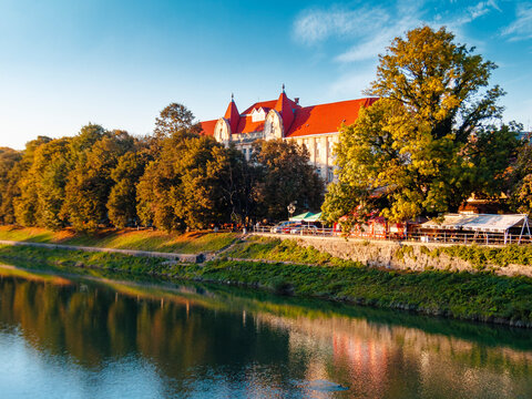 uzhhorod, ukraine - 17 oct, 2012: river uzh on autumn evening. uzhhorod city travel background. panoramic view of a historic cityscape by the water. urban landscape of old town in euroope
