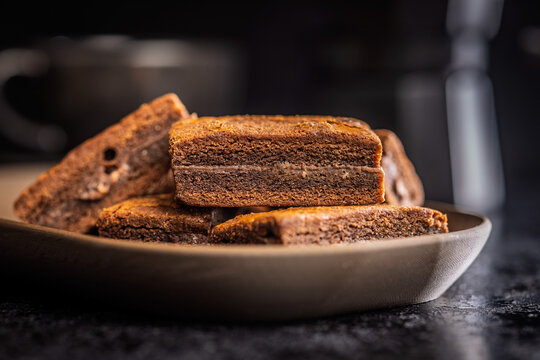 Stacked Chocolate Brownies On Plate Close-Up Rustic Dessert With Rich Fudge Layers