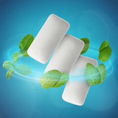 Menthol chewing gum pieces and mint leaves in air against blue background © New Africa