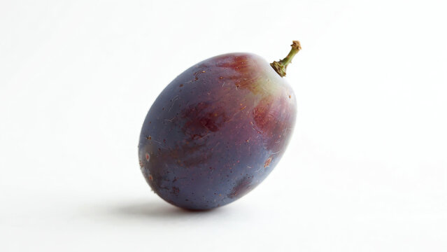 Elegant single grape positioned on a pristine white backdrop, highlighting its smooth skin and subtle color variations, with soft diffuse lighting creating a serene atmosphere