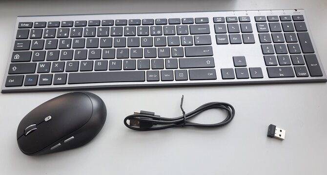 Wireless computer keyboard, mouse, charging cable, and USB receiver