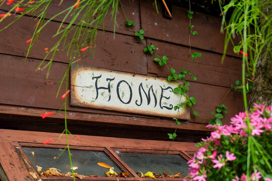 Home Sign,House sign at garden,front of house,Flower Garden landscape design,Home sweet Home on rustic wood,space for text.