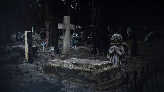 Angel Praying Over Grave Dark Cemetery 4K Loop features an old west cemetery in Colorado with a statue of a child angel praying over a tomb with snow swirling in the air.