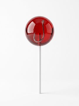 Translucent red lollipop with sharp fishing hook inside, deceptive marketing bait and consumer scam concept on white background