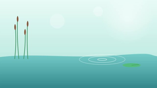 Cattails and a lily pad in a calm blue pond on a bright sunny day
