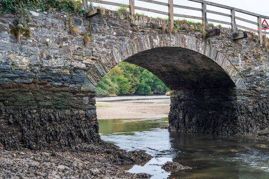 Historic Stone Arch Bridge Crossing Estuary in Looe Cornwall England