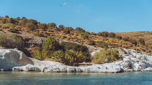 Fo&ccedil;a, Turkey - September 12, 2026: View of Tavşan Adası (Rabbit Island) near Fo&ccedil;a, showing a rocky island, blue Aegean Sea water, and scenic coastal landscape.