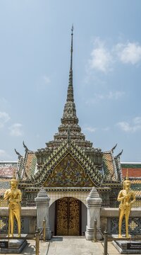 Golden guardian figures in front of entrance, Wat Phra Kaew, Temple of the Emerald Buddha, Royal Palace, Bangkok, Central Thailand, Thailand