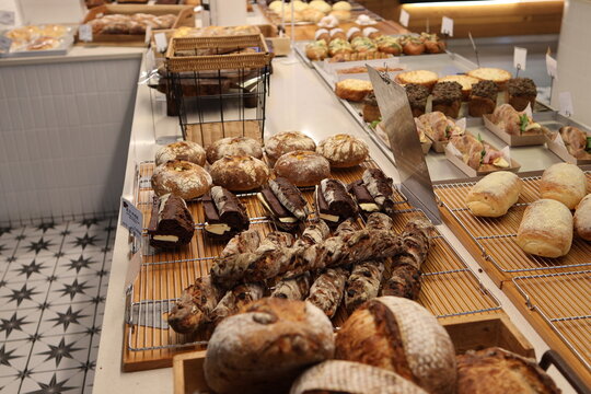 Variety of freshly baked artisan bread on display in a bakery