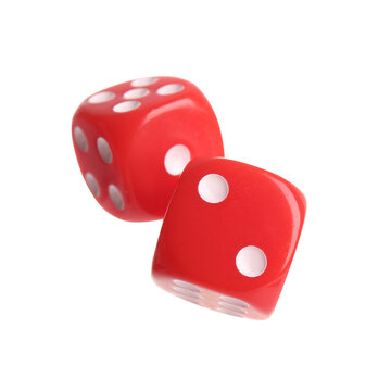 Risk and probability concept, two red dice rolling for luck and chance in business strategy or gambling games isolated on a clean white background