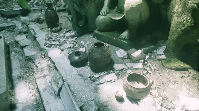 Amidst dense foliage, ancient pottery lies scattered around stone statues. The scene captures an atmosphere of history and mystery, illuminated by soft sunlight filtering through the trees.