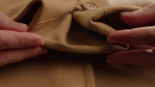 Light brown Beige wool coat background, natural sheepskin close-up macro coat. Top view